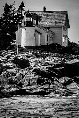 Winter Harbor Light Overlooks Rocky Island Shoreline -BW